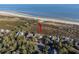 Aerial view of home nestled within a lush, treed lot close to beach and coastal waterways at 2238 Catesbys Blf, Seabrook Island, SC 29455