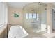 Bright bathroom featuring a standalone tub, a walk-in shower, and a modern design at 2238 Catesbys Blf, Seabrook Island, SC 29455