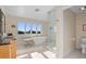 Bright bathroom featuring a standalone tub, a walk-in shower, and a double sink vanity at 2238 Catesbys Blf, Seabrook Island, SC 29455