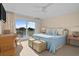 Serene bedroom featuring plush bedding, balcony access, and water views, creating a relaxing retreat at 2238 Catesbys Blf, Seabrook Island, SC 29455