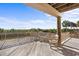 Expansive wooden deck with railing, providing ample seating to enjoy lush outdoor scenery at 2238 Catesbys Blf, Seabrook Island, SC 29455