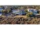 Striking home showcasing a two-story design, a large deck, and picturesque coastal landscaping at 2238 Catesbys Blf, Seabrook Island, SC 29455