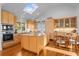 Kitchen with an island, wood cabinetry, and modern appliances at 2238 Catesbys Blf, Seabrook Island, SC 29455