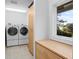 Bright laundry room featuring a side-by-side washer and dryer, and a convenient folding counter at 2238 Catesbys Blf, Seabrook Island, SC 29455
