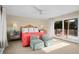 Comfortable bedroom with sliding glass doors to balcony and comfortable chairs at 2238 Catesbys Blf, Seabrook Island, SC 29455