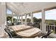 Outdoor sunroom features tile table and beautiful views at 2238 Catesbys Blf, Seabrook Island, SC 29455