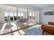 Bright sunroom with sliding glass doors, tile flooring, and comfortable seating offering serene views at 2238 Catesbys Blf, Seabrook Island, SC 29455