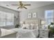 Cozy bedroom with a window view, neutral decor, bedside lamps and decorative wall art at 2320 Chadbury Ln, Mount Pleasant, SC 29466