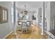 Bright dining area features a modern chandelier, white table and chairs, and plenty of natural light at 2320 Chadbury Ln, Mount Pleasant, SC 29466