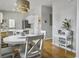 Open dining area features a modern chandelier and seamless access to the adjoining kitchen at 2320 Chadbury Ln, Mount Pleasant, SC 29466