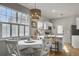 Bright dining area offers a contemporary chandelier, with views to the modern kitchen at 2320 Chadbury Ln, Mount Pleasant, SC 29466