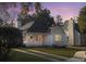 Charming single-story home with a quaint porch, well-manicured lawn, and welcoming curb appeal under a colorful sky at 2320 Chadbury Ln, Mount Pleasant, SC 29466