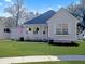 Charming single-story home with a inviting porch, well-manicured lawn, and welcoming curb appeal at 2320 Chadbury Ln, Mount Pleasant, SC 29466