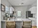 Bright kitchen features white cabinets, stainless steel appliances, and a stylish backsplash at 2320 Chadbury Ln, Mount Pleasant, SC 29466
