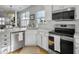 Modern kitchen with stainless steel appliances, white cabinets, and a stylish backsplash at 2320 Chadbury Ln, Mount Pleasant, SC 29466