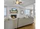 Inviting living room with an open floor plan that flows to the dining area and kitchen, offering seamless living at 2320 Chadbury Ln, Mount Pleasant, SC 29466