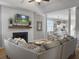 Cozy living room featuring a fireplace, open to the dining area and kitchen, perfect for entertaining at 2320 Chadbury Ln, Mount Pleasant, SC 29466
