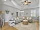 Spacious living room featuring hardwood floors, neutral tones, and an inviting seating arrangement at 2320 Chadbury Ln, Mount Pleasant, SC 29466