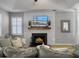 Bright living room with a modern fireplace and ample natural light, creating a cozy and inviting space at 2320 Chadbury Ln, Mount Pleasant, SC 29466