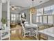 Open living space featuring a dining area, living room, and backyard views through sunlit windows at 2320 Chadbury Ln, Mount Pleasant, SC 29466