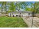 A backyard featuring a concrete area and a grassy section with a privacy fence at 2420 Cherokee Hall Ln, Charleston, SC 29414