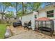A backyard with a concrete area featuring some cooking amenities on one side at 2420 Cherokee Hall Ln, Charleston, SC 29414