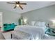 Bright bedroom with a white bed, bench, accent furniture, and ceiling fan at 2420 Cherokee Hall Ln, Charleston, SC 29414