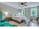 Cozy bedroom with neutral tones, natural light, and a ceiling fan at 2420 Cherokee Hall Ln, Charleston, SC 29414
