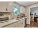 Well-lit modern kitchen with stainless steel dishwasher and sink under the window at 2420 Cherokee Hall Ln, Charleston, SC 29414