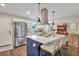 Bright kitchen with stainless steel appliances, white cabinets, and a large island with seating at 2420 Cherokee Hall Ln, Charleston, SC 29414