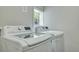 Clean laundry room with new washer and dryer units under a sunny window at 2420 Cherokee Hall Ln, Charleston, SC 29414