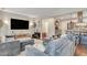 Comfortable living room with a large sectional sofa and view into the kitchen at 2420 Cherokee Hall Ln, Charleston, SC 29414