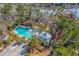 An aerial view showcasing the pool and amenity center surrounded by nature and waterfront views at 2615 Rutherford Way, Charleston, SC 29414