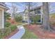Backyard view of the property, featuring a well-maintained lawn and walkway at 2615 Rutherford Way, Charleston, SC 29414
