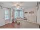 Charming bedroom with hardwood floors, neutral walls, and a comfortable chair near the window at 2615 Rutherford Way, Charleston, SC 29414