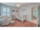 Cozy bedroom featuring hardwood floors, lots of natural light, and neutral walls at 2615 Rutherford Way, Charleston, SC 29414
