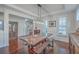 Dining room featuring wood floors, wainscotting, a large wooden table, and decorative furnishings at 2615 Rutherford Way, Charleston, SC 29414