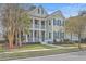 Charming two-story home with double porches, neat landscaping, and traditional shutters at 2615 Rutherford Way, Charleston, SC 29414
