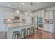 Gourmet kitchen featuring granite countertops, stainless appliances, and bar seating at the island at 2615 Rutherford Way, Charleston, SC 29414