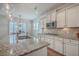 Bright kitchen features granite counters, stainless appliances, and ample cabinet space at 2615 Rutherford Way, Charleston, SC 29414
