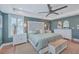 Comfortable main bedroom with trey ceiling, ceiling fan, neutral tones, and shuttered windows at 2615 Rutherford Way, Charleston, SC 29414