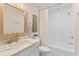 Bathroom featuring a marble vanity with gold accents, a decorative mirror and shower with curtain at 274 Alexandra Dr # 14, Mount Pleasant, SC 29464