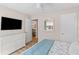 Bedroom featuring a TV, dresser and access to an exterior door and view to dining room at 274 Alexandra Dr # 14, Mount Pleasant, SC 29464