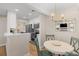 Charming dining area adjacent to the kitchen, featuring modern lighting at 274 Alexandra Dr # 14, Mount Pleasant, SC 29464