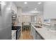 Bright kitchen with stainless steel appliances and a view into the dining area and featuring patterned backsplash at 274 Alexandra Dr # 14, Mount Pleasant, SC 29464