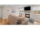 Comfortable living room with a fireplace, large window, and stylish furnishings at 274 Alexandra Dr # 14, Mount Pleasant, SC 29464