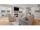 Cozy living room featuring a fireplace, wood floors, and neutral tones at 274 Alexandra Dr # 14, Mount Pleasant, SC 29464