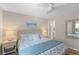 Well-lit main bedroom with an upholstered headboard, ceiling fan and coastal-themed decor at 274 Alexandra Dr # 14, Mount Pleasant, SC 29464