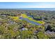 Aerial view of coastal home near the ocean, a lagoon, and golf course at 31 Berkshire Hall, Kiawah Island, SC 29455