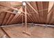 Exposed rafters in an unfinished attic with ductwork and plywood flooring at 31 Berkshire Hall, Kiawah Island, SC 29455